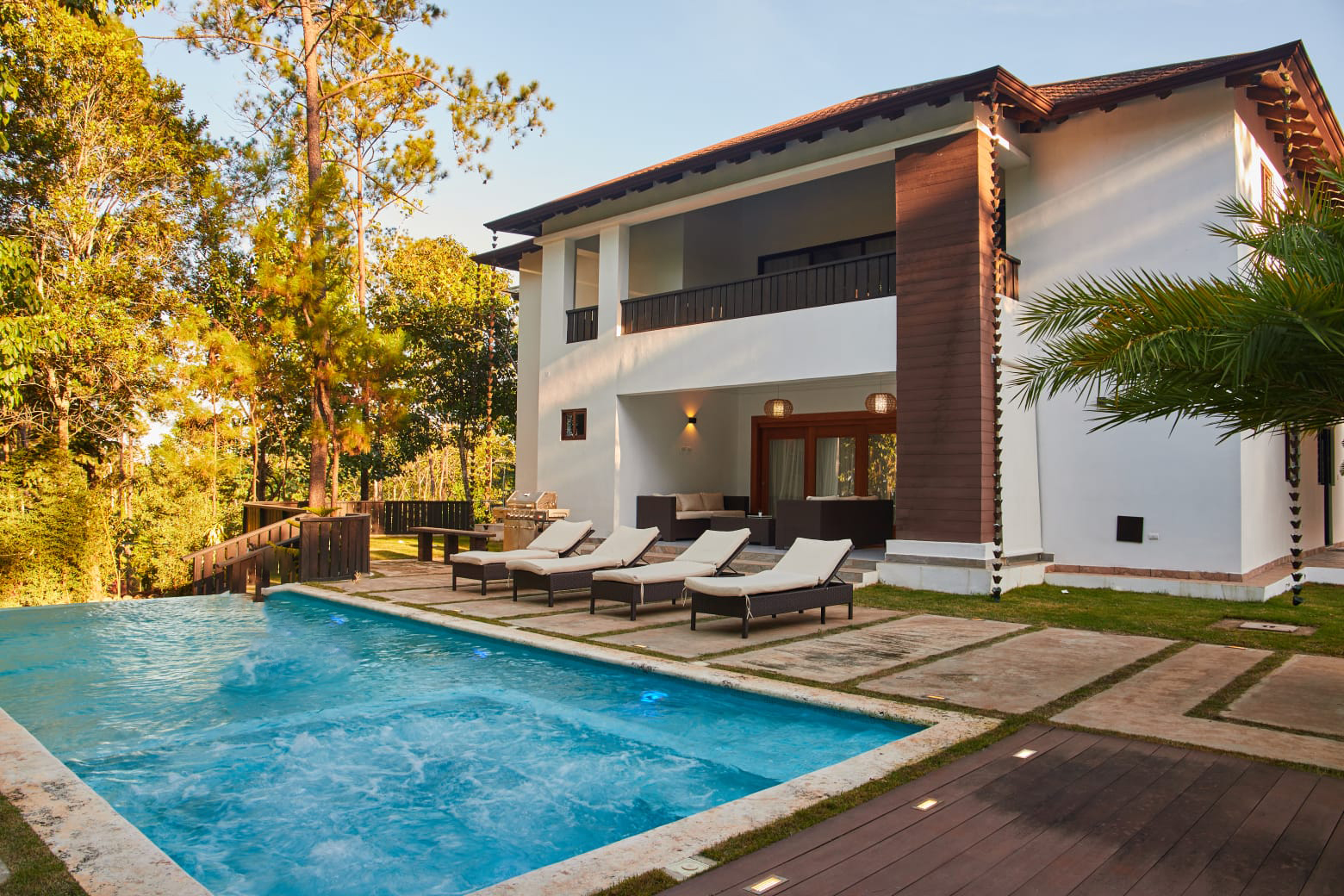 Residence pool surrounded by highland gardens